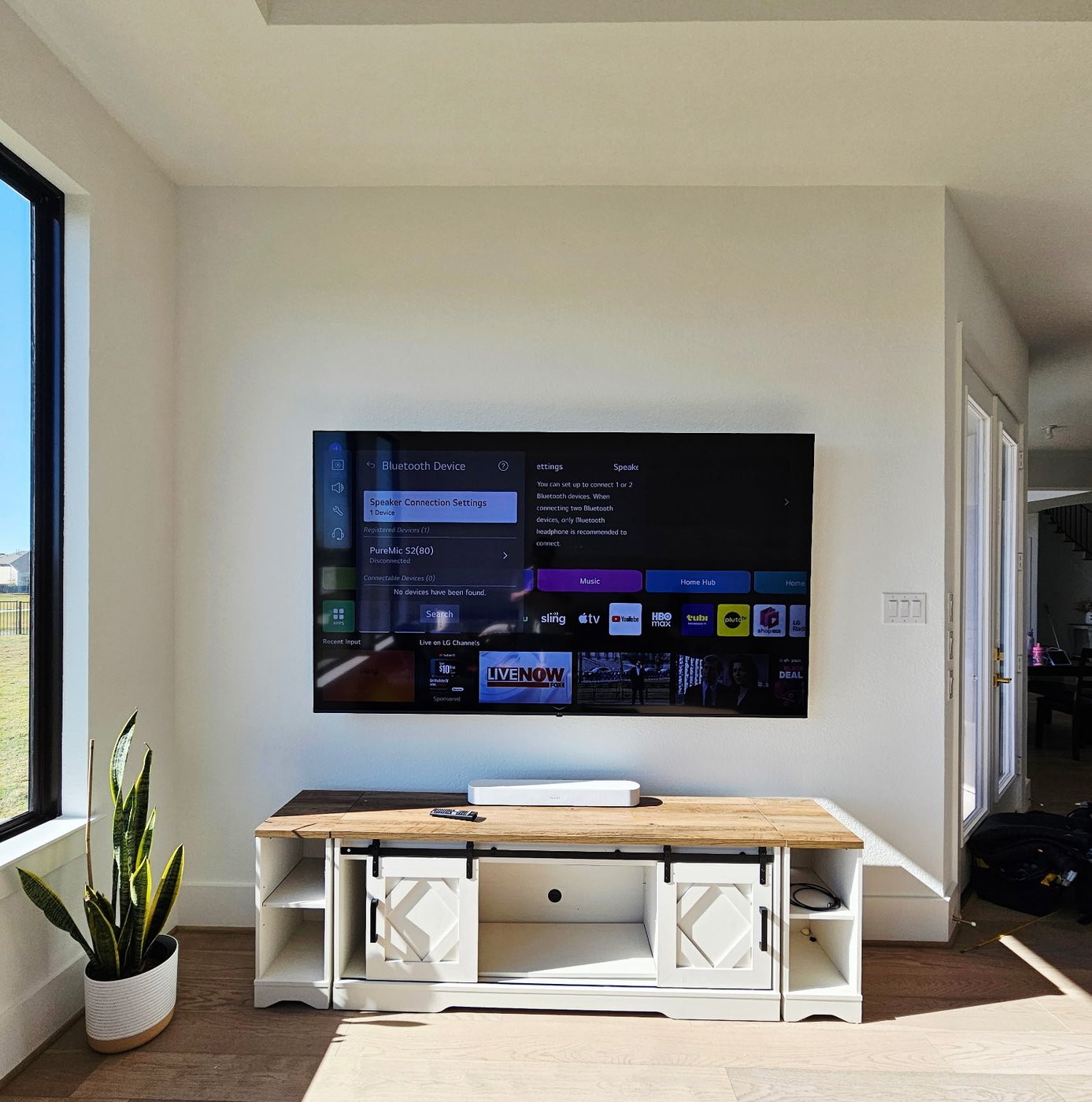 Bright daylight TV installation in a modern Houston home.